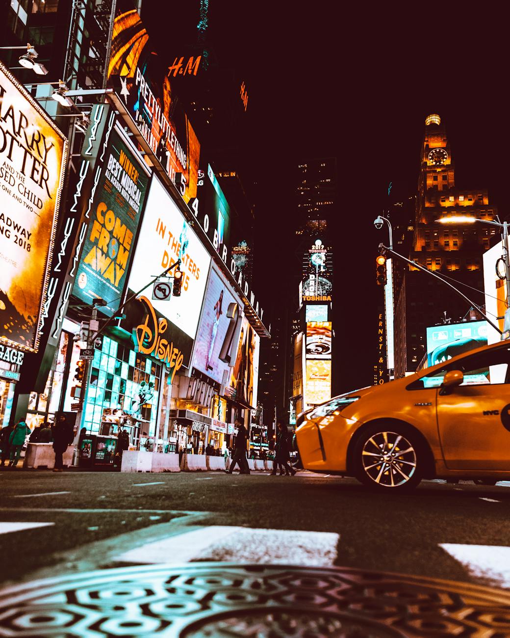 yellow taxi in the middle of new york times square